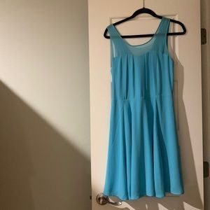 Aqua cocktail dress. Sheer straps and back.
